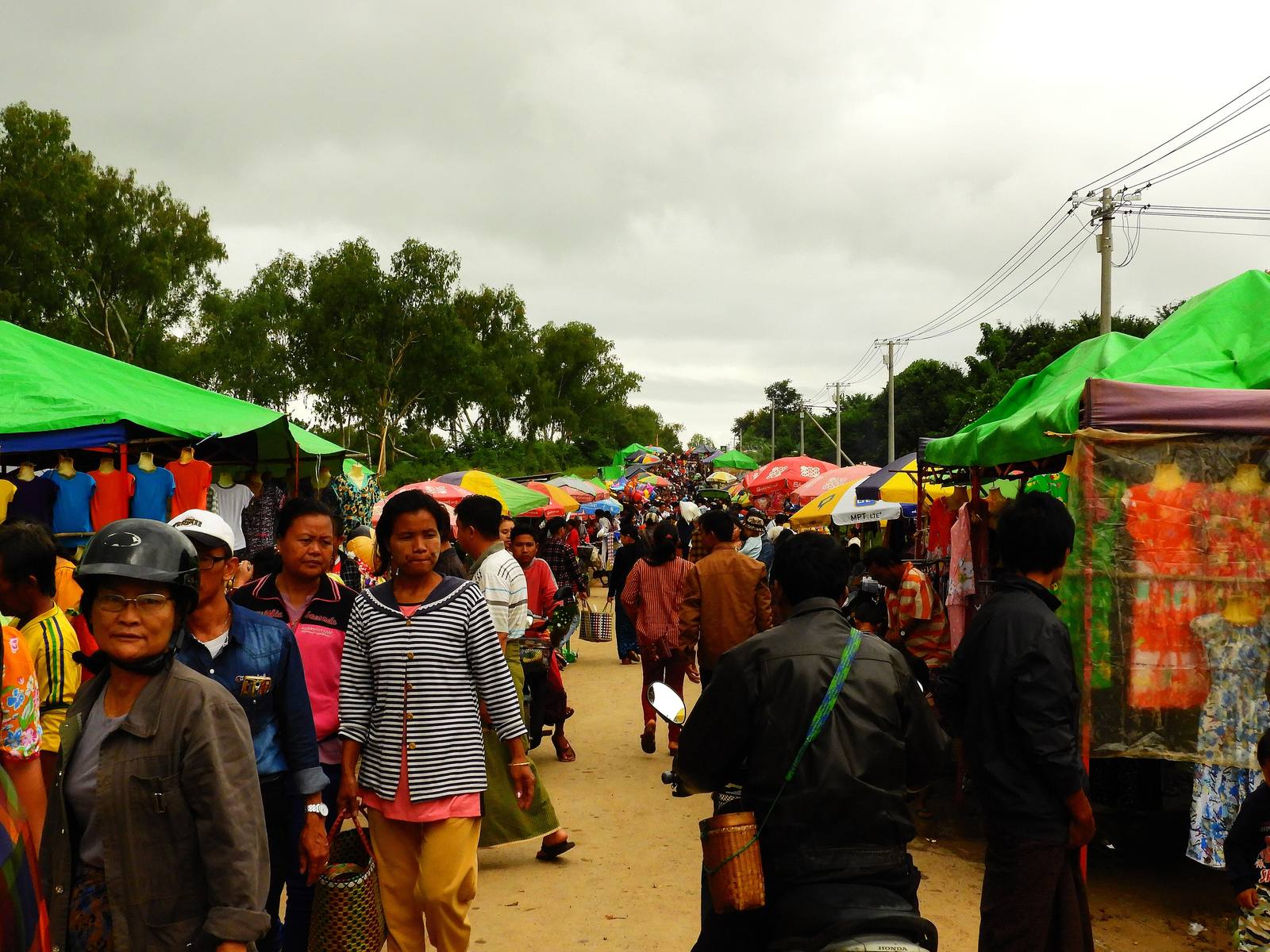 People buying and selling produce at Naungyah Market in Loikaw, Kayah State, Myanmar